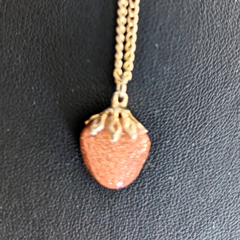 A Sunstone pendant on a Gold toned chain 19” inches. - Picture 2 of 5